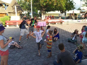 A group of people in a 'circle' playing poison frog.