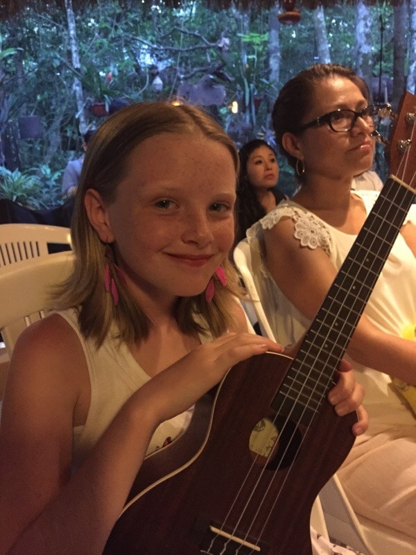 Me, holding my teachers ukulele.